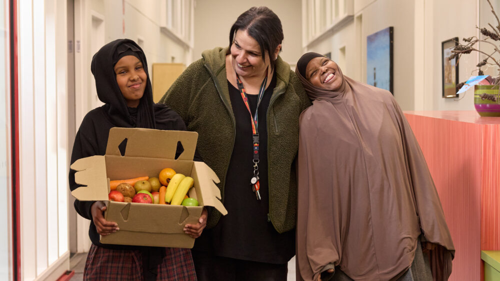 Mother and daughter receiving The One Box