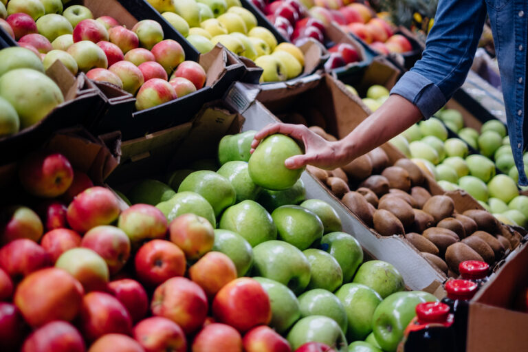 Woman picking healthy fresh fruit on World Health Day