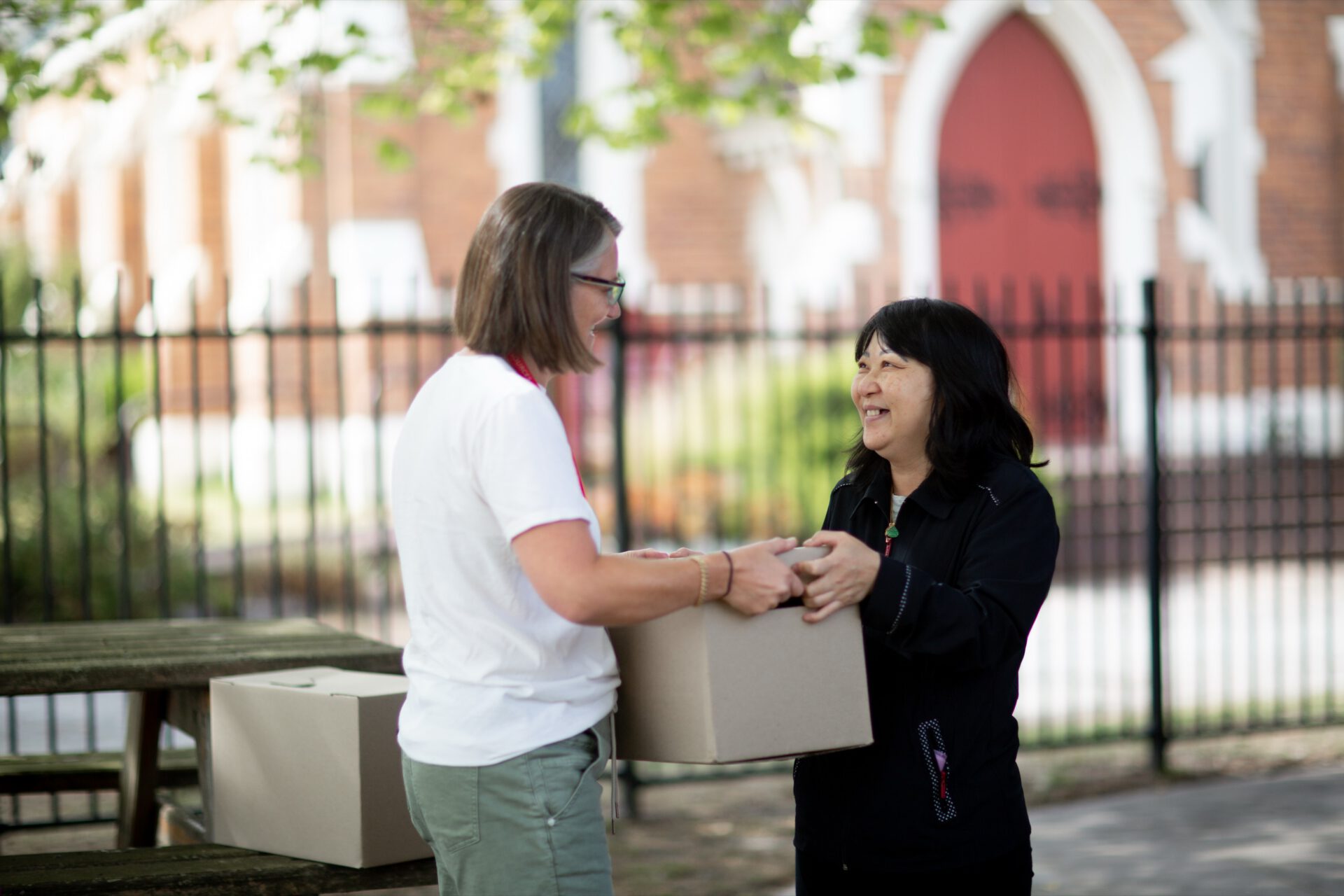A Fresh Food Project partner handing over a produce box