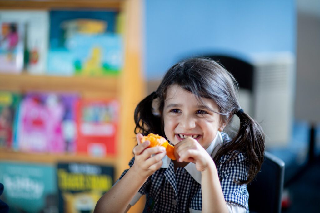 A student eating fruit
