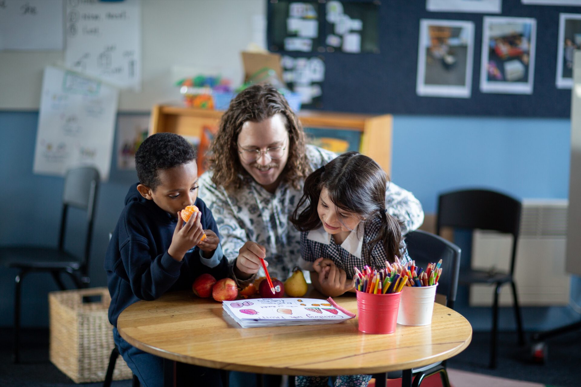 A school wellbeing staff member talking with a family