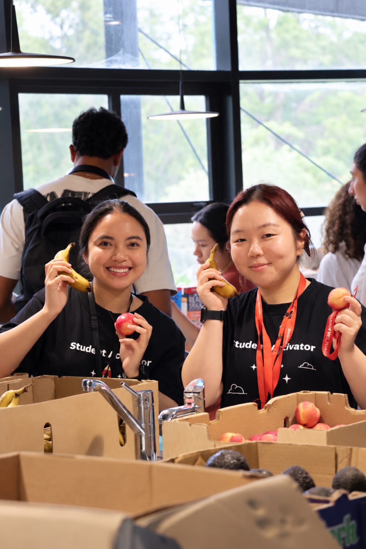 University students with fresh fruit at a Fresh Food Project stall